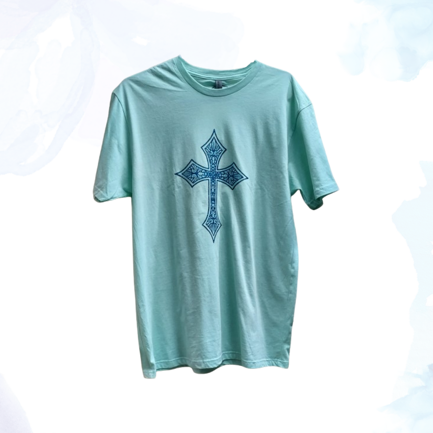 Introducing our Mint Green T-shirt with a Blue Glittery Cross, where comfort meets style in a dazzling blend. Crafted from premium cotton, this t-shirt ensures a soft and breathable feel, perfect for everyday wear. The standout feature of this shirt is its eye-catching blue glittery cross design, meticulously placed on the front. The shimmering blue adds a touch of elegance and flair, making this t-shirt ideal for both casual outings and special occasions.