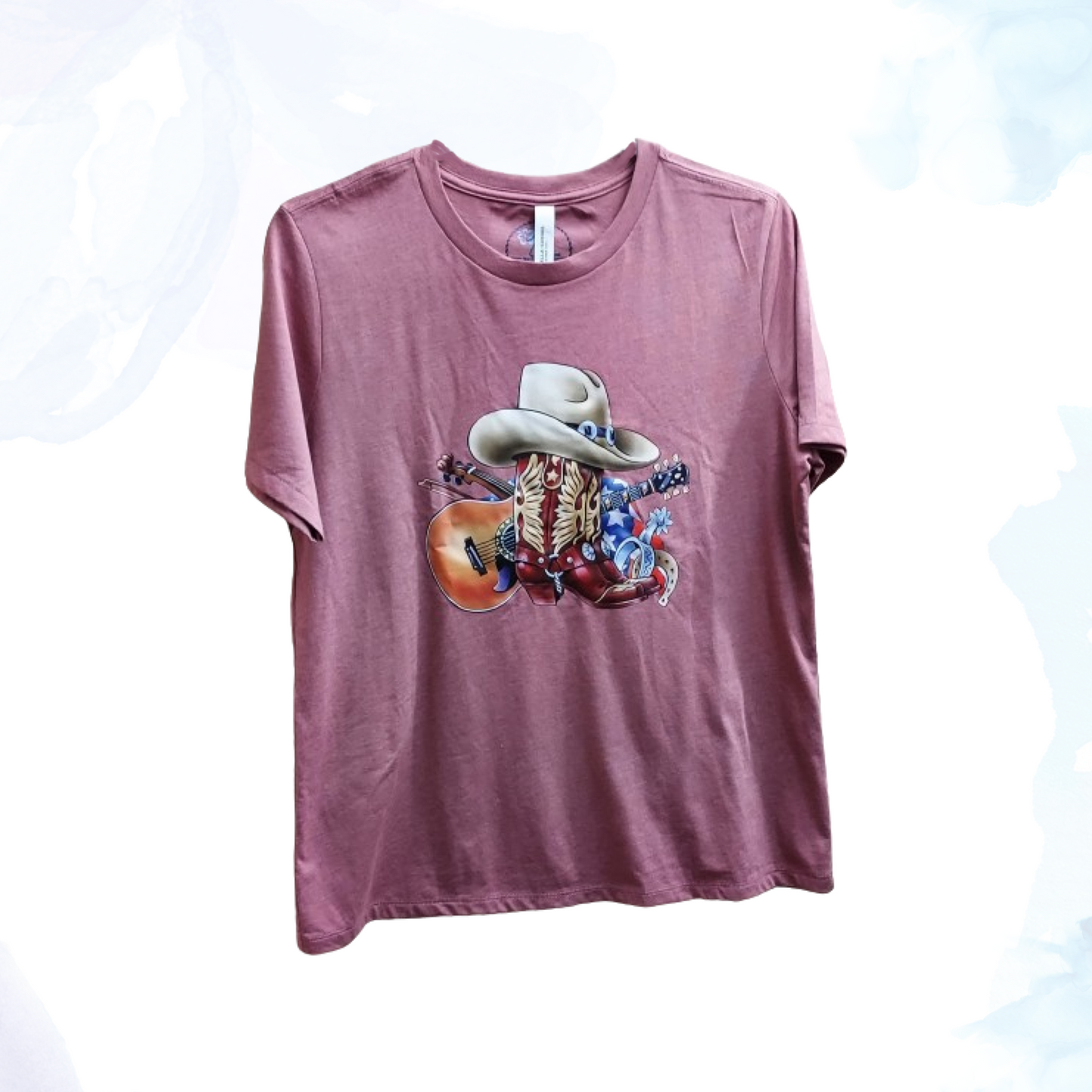 Saddle up for style with our Cowboy Boots & Hat/Guitar Tee, where Western flair meets musical charm. Perfect for those who love the rugged spirit of the Wild West and the soulful twang of country music, this t-shirt embodies the essence of Americana. Emblazoned with a striking graphic featuring classic cowboy boots, a hat, and a guitar, this tee captures the essence of frontier adventure and musical passion.