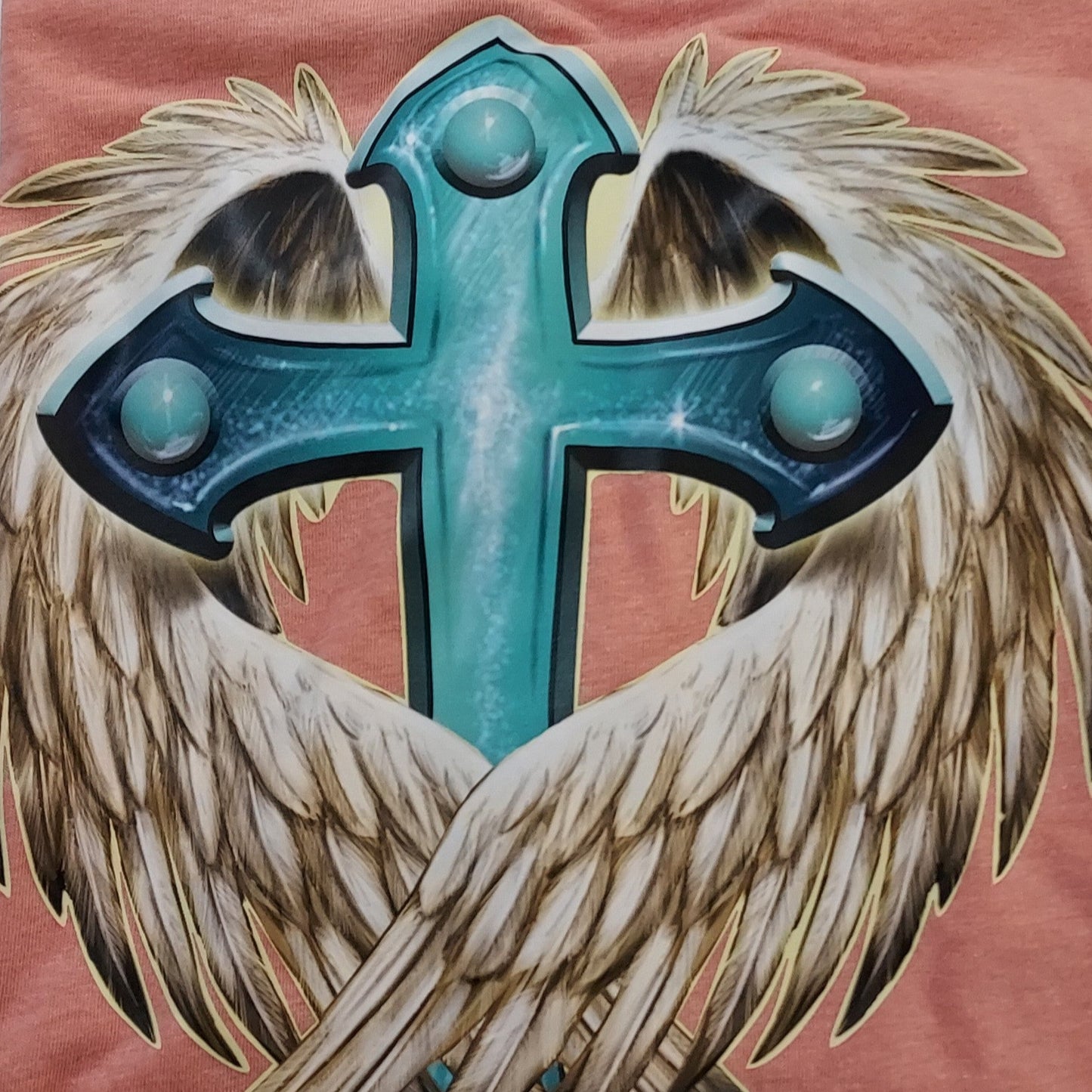 Embrace a blend of faith and freedom with our Cross & Wings Tee, a symbol of spiritual strength and personal expression. This striking t-shirt is designed for those who value both their faith and their individuality, making it a meaningful addition to any wardrobe.
