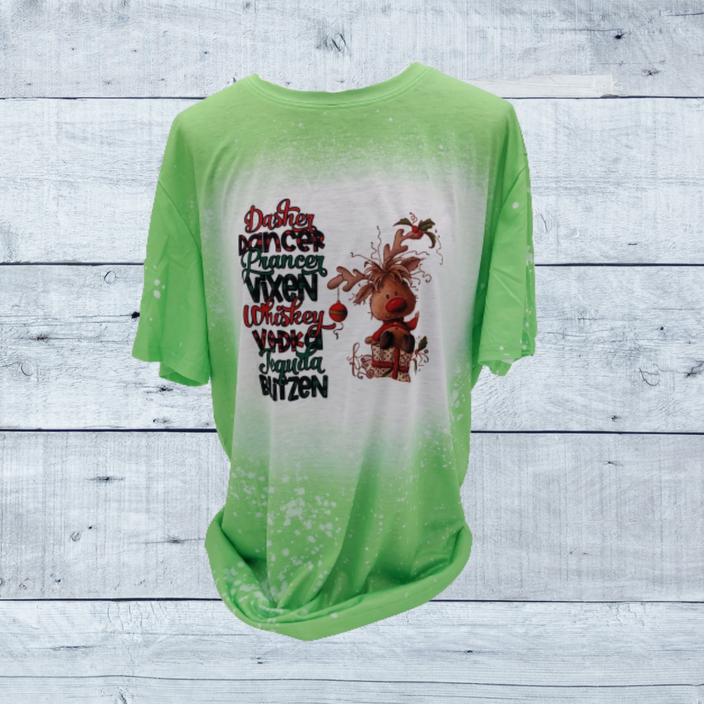 Christmas is a time for fun, parties and celebrating. You will be in the holiday spirit with this fun holiday themed faux bleached t-shirt. Introducing the "Dasher, Dancer, Prancer, Vixen, Whiskey, Vodka, Tequila, Blitzen Faux Bleached Tee," where festive spirit meets modern style. This unique tee blends classic holiday cheer with contemporary fashion, making it a must-have for every celebration.