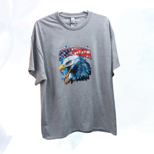 Show your patriotic pride with our "Don't Mess With America" t-shirt!   Crafted from a premium 50/50 blend of cotton and polyester for unmatched comfort and durability. The classic gray hue complements the bold eagle head graphic emblazoned across the chest, symbolizing strength, freedom, and resilience.
