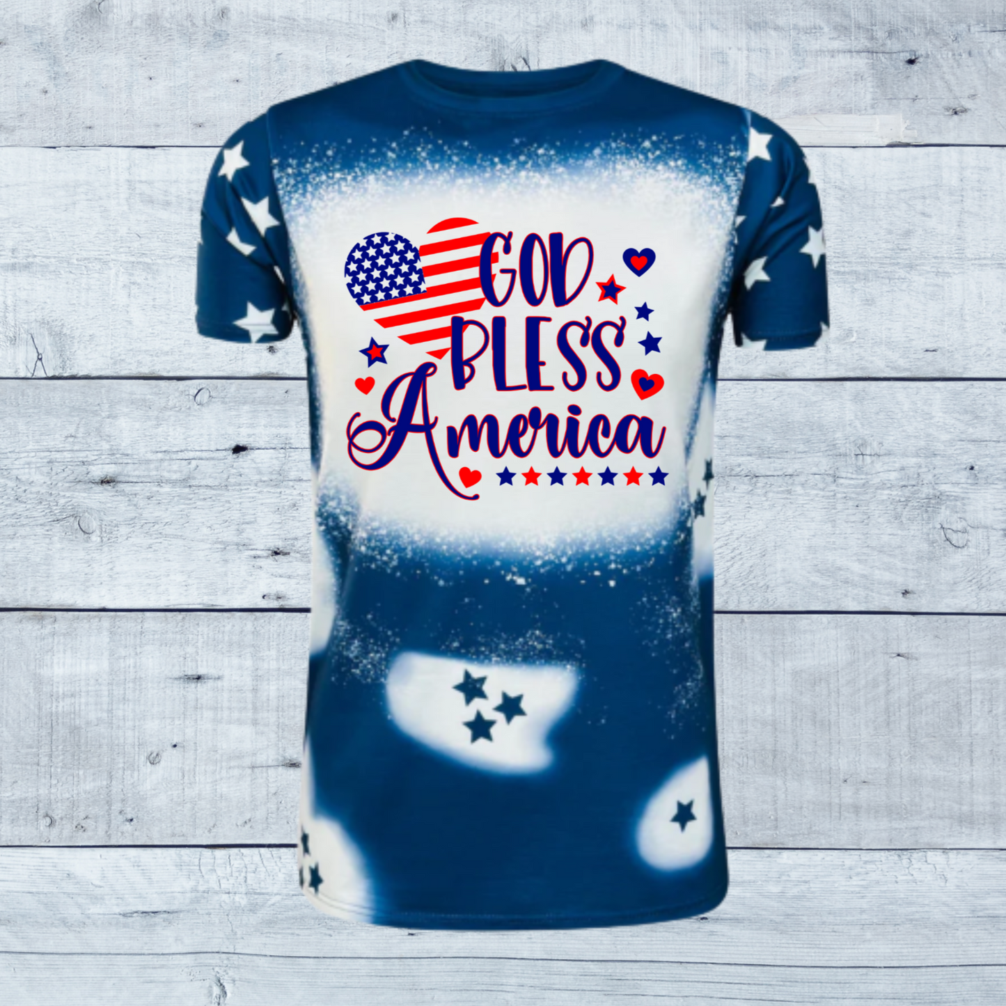 Celebrate the spirit of America with our stunning "God Bless America Stars Faux Bleached Tee," available in bold red or deep blue. This shirt is more than just a piece of clothing; it's a patriotic statement designed to evoke pride and admiration for our great nation
