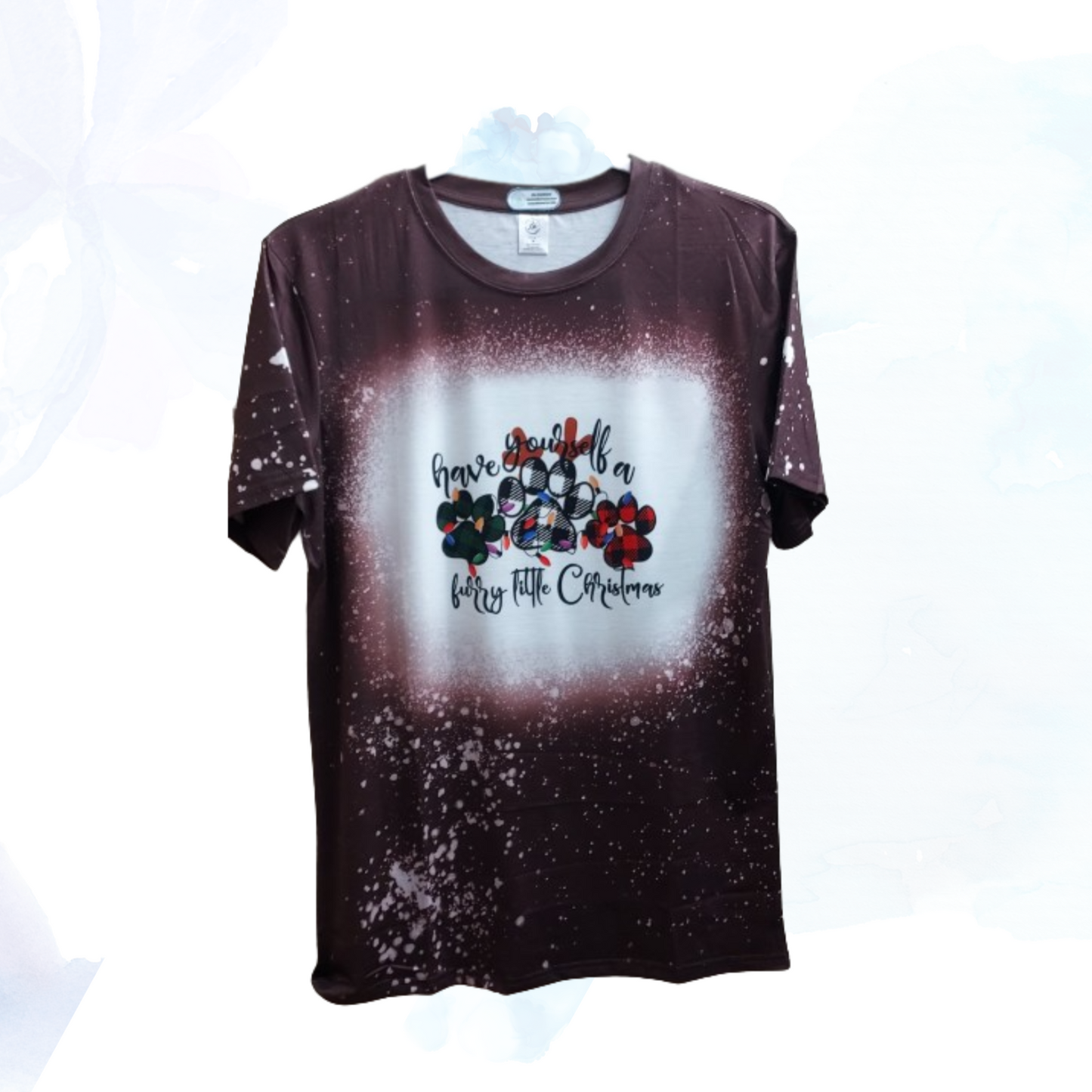 Introducing the "Have Yourself a Furry Little Christmas Brown Faux Bleached Tee," the perfect blend of festive charm and cozy comfort for the holiday season. Crafted with care, this tee combines a stylish brown hue with a faux bleached effect, giving it a unique and vintage-inspired look that stands out.