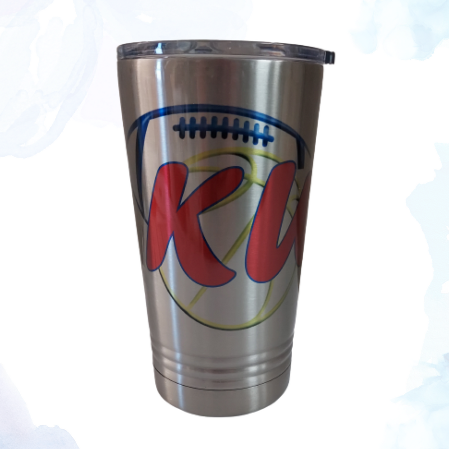 A 16 oz. stainless steel tumbler featuring a dual KU football and basketball design. This tumbler showcases the KU team logos and colors, celebrating both football and basketball. Made from durable stainless steel, it keeps beverages hot or cold for extended periods. Perfect for KU sports fans to enjoy their favorite drinks while supporting their teams on the go.