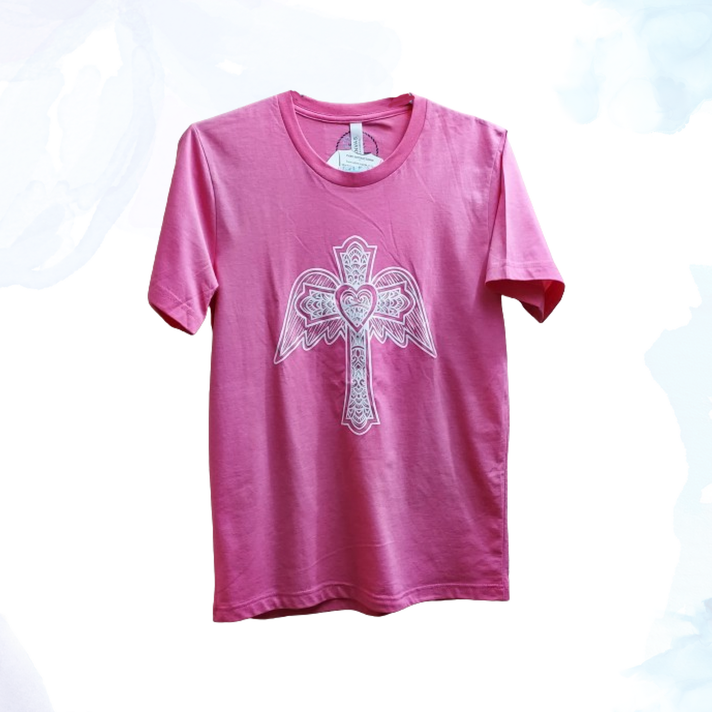 The Glitter Winged Cross Pink Tee, where style meets symbolism in a dazzling display. This captivating t-shirt blends contemporary fashion with a touch of spiritual inspiration, perfect for those who appreciate both trendsetting design and meaningful motifs.