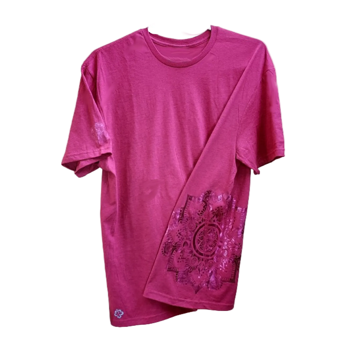 A pink colored t-shirt with a mandala design on the front.