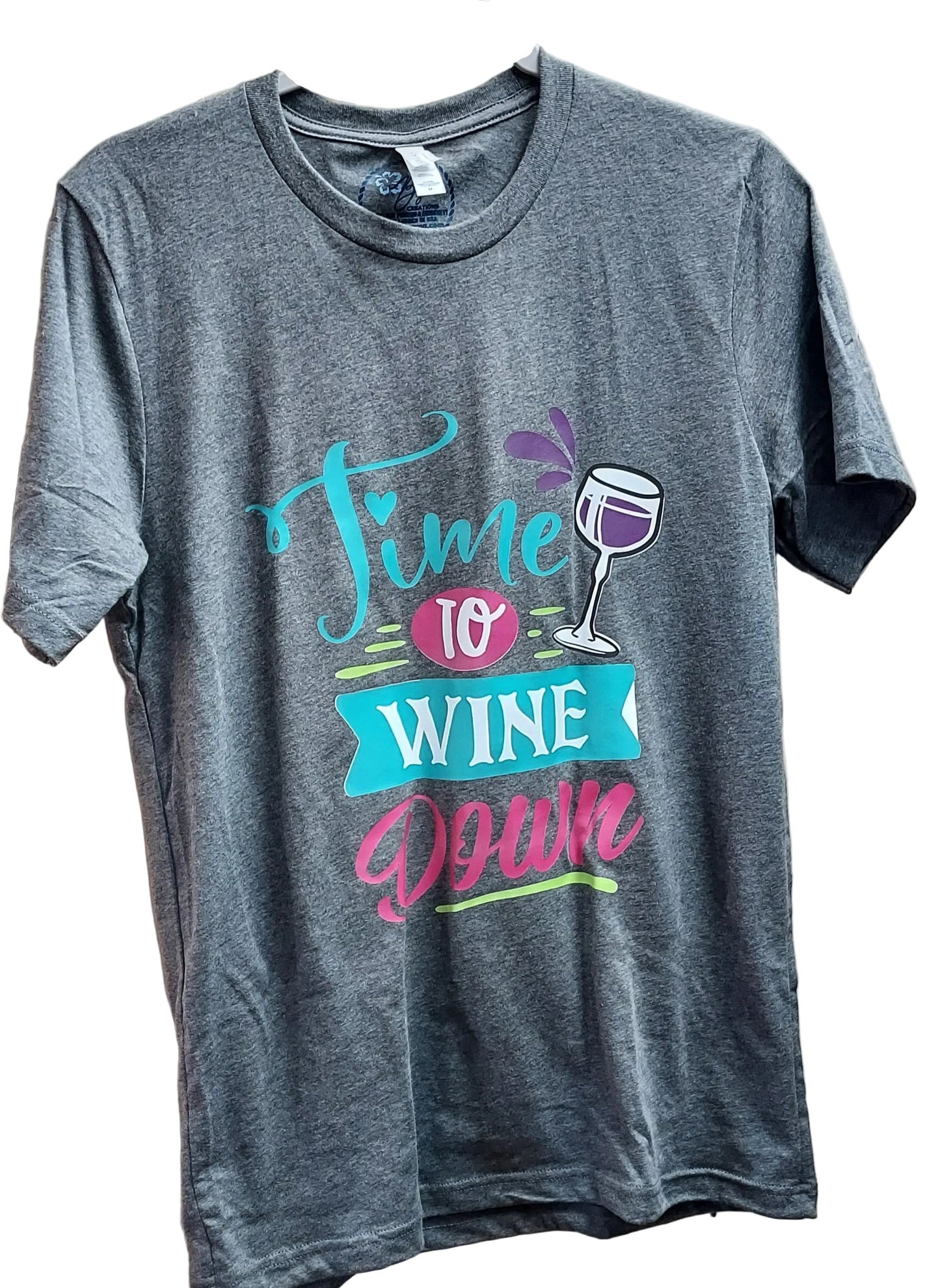 A gray t-shirt with a slogan 'Time to WINE DOWN' printed on the front, featuring a graphic of a wine glass.