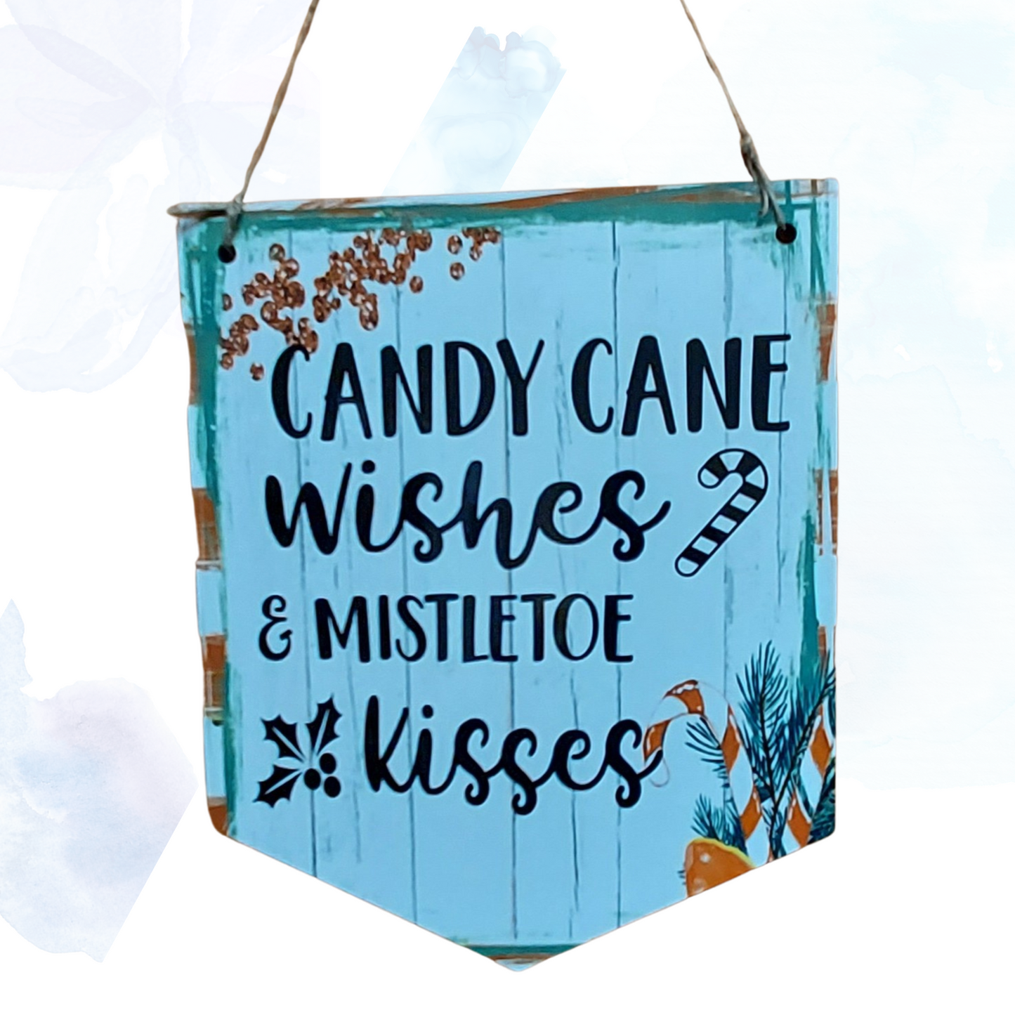 Transform your home into a winter wonderland with the enchanting Candy Cane Wishes Mistletoe Wishes pendant wall decor. This exquisite piece captures the essence of holiday magic, featuring delicate mistletoe intertwined with whimsical candy cane accents. Crafted with meticulous attention to detail, it exudes a festive charm that will instantly elevate your seasonal decor.