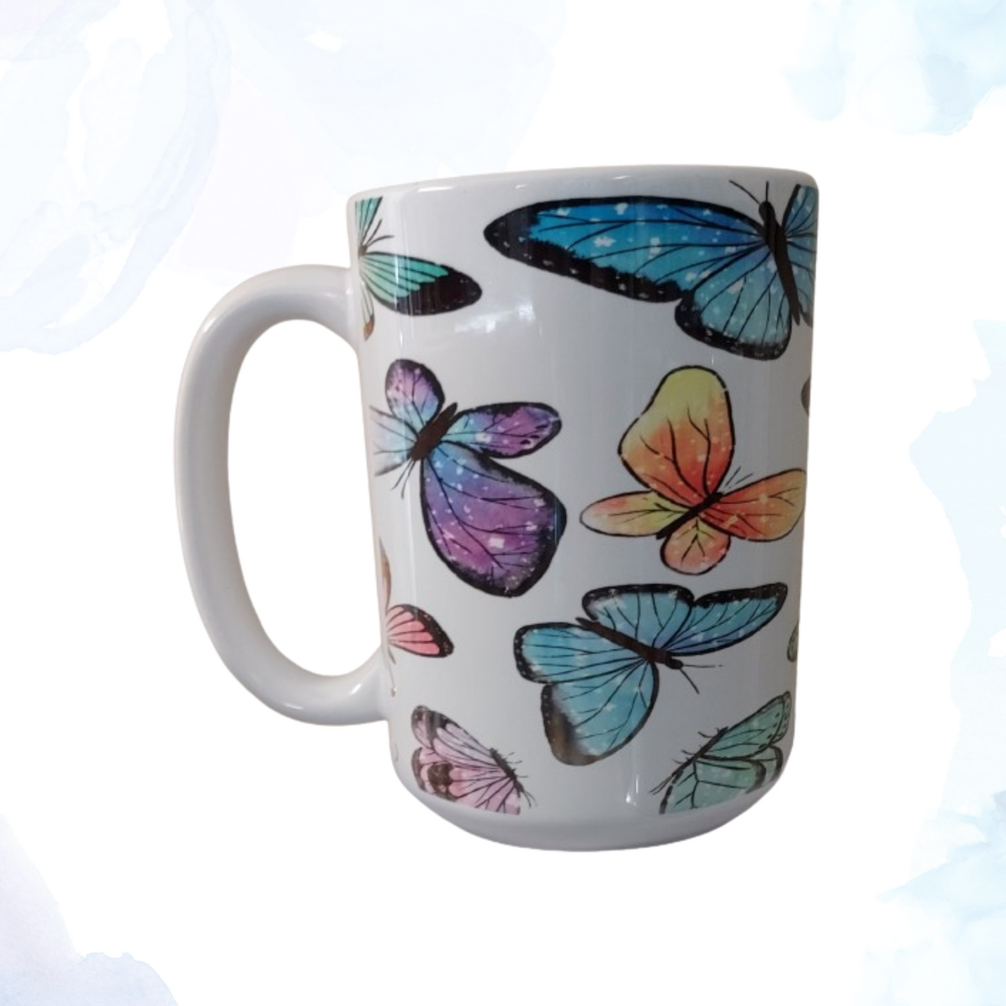 Embrace the beauty of nature with our exquisite 15 oz. Ceramic Butterfly Mug. This enchanting mug features a captivating design of vibrant butterflies fluttering gracefully across its surface. Each butterfly is intricately detailed, showcasing a spectrum of colors that bring a touch of elegance and whimsy to your morning routine. Crafted from high-quality ceramic, this mug is both durable and stylish, making it perfect for enjoying your favorite hot beverages.