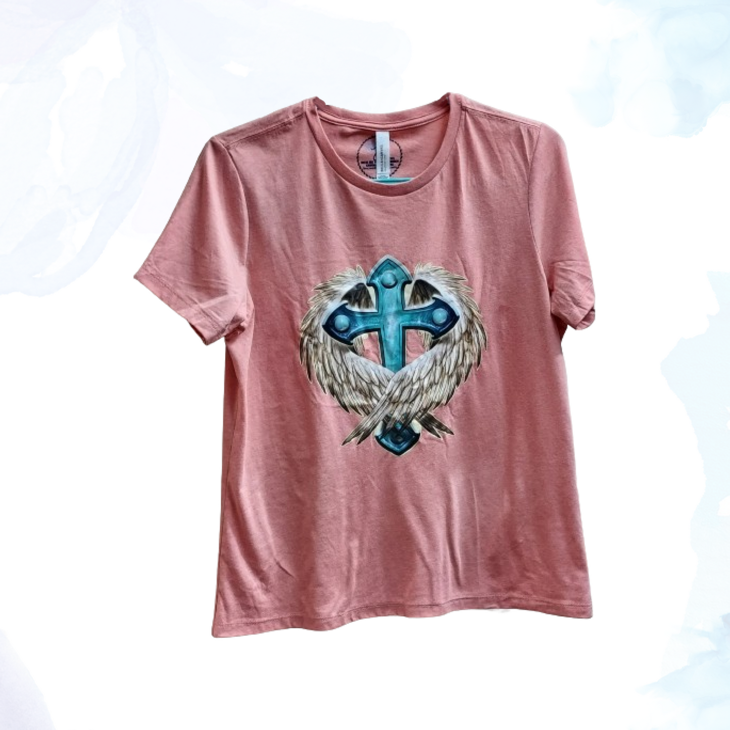 Embrace a blend of faith and freedom with our Cross & Wings Tee, a symbol of spiritual strength and personal expression. This striking t-shirt is designed for those who value both their faith and their individuality, making it a meaningful addition to any wardrobe.