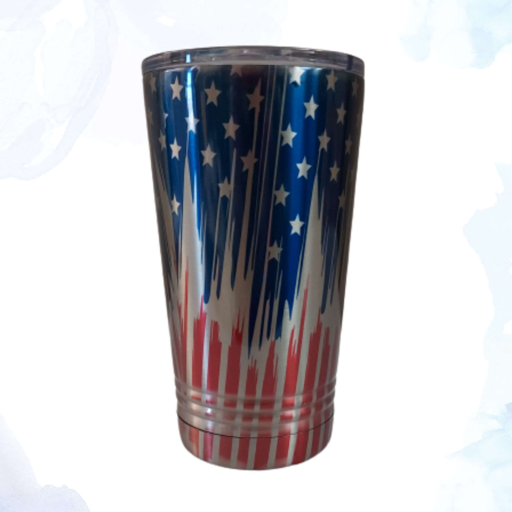 A 16 oz. stainless steel tumbler featuring a dynamic dripping American flag design. This eye-catching tumbler showcases the flag with a unique, artistic dripping effect. Made from durable stainless steel, it keeps drinks hot or cold for extended periods. Perfect for adding a touch of patriotism to your daily routine while enjoying your favorite beverages on the go.