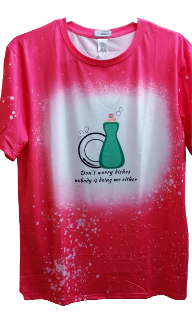 Uncertain about doing the dishes? Don't worry - with this soft, comfy t-shirt you won't have to shell out any sort of effort at all!  Our vibrant bright pink faux bleached tee featuring the cheeky "Don't Worry Dishes Nobody Is Doing Me Either" —a must-have for those who appreciate a touch of humor and style in their wardrobe. This tee isn't just about looks; it's crafted for comfort and durability, using high-quality materials that ensure a soft feel against your skin and long-lasting wear