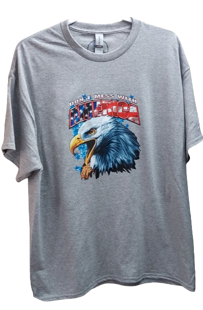 Show your patriotic pride with our "Don't Mess With America" t-shirt!  &nbsp;Crafted from a premium 50/50 blend of cotton and polyester for unmatched comfort and durability. The classic gray hue complements the bold eagle head graphic emblazoned across the chest, symbolizing strength, freedom, and resilience.