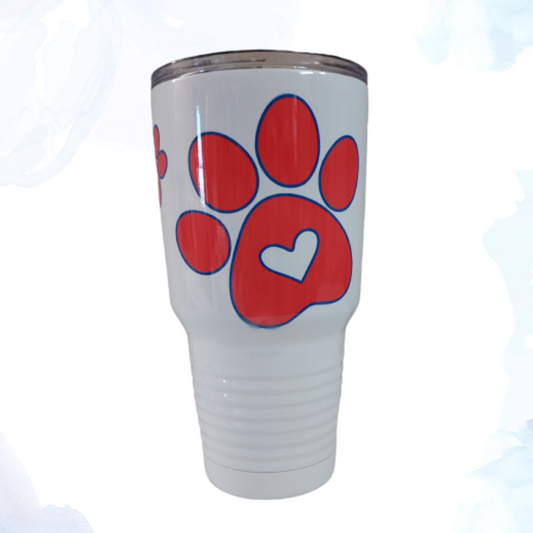 Stay refreshed and show off your love for pets with our White 30 oz. Stainless Steel Tumbler, adorned with vibrant red and blue paw prints.  This tumbler isn't just about looks; it's built to deliver superior performance, whether you're at home, at the office, or on the go.