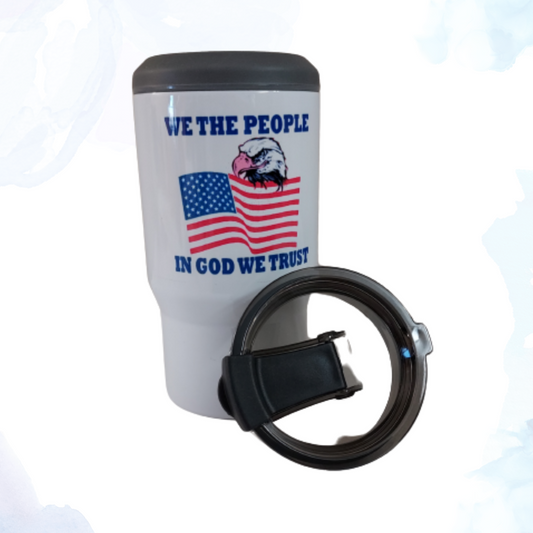 An 11 oz. white bottle holder featuring a patriotic design. The holder displays an American eagle and flag alongside the words "We The People" and "In God We Trust" in bold, decorative fonts. This durable and stylish bottle holder is perfect for keeping beverages cool while showcasing American pride. Ideal for picnics, barbecues, and outdoor events.