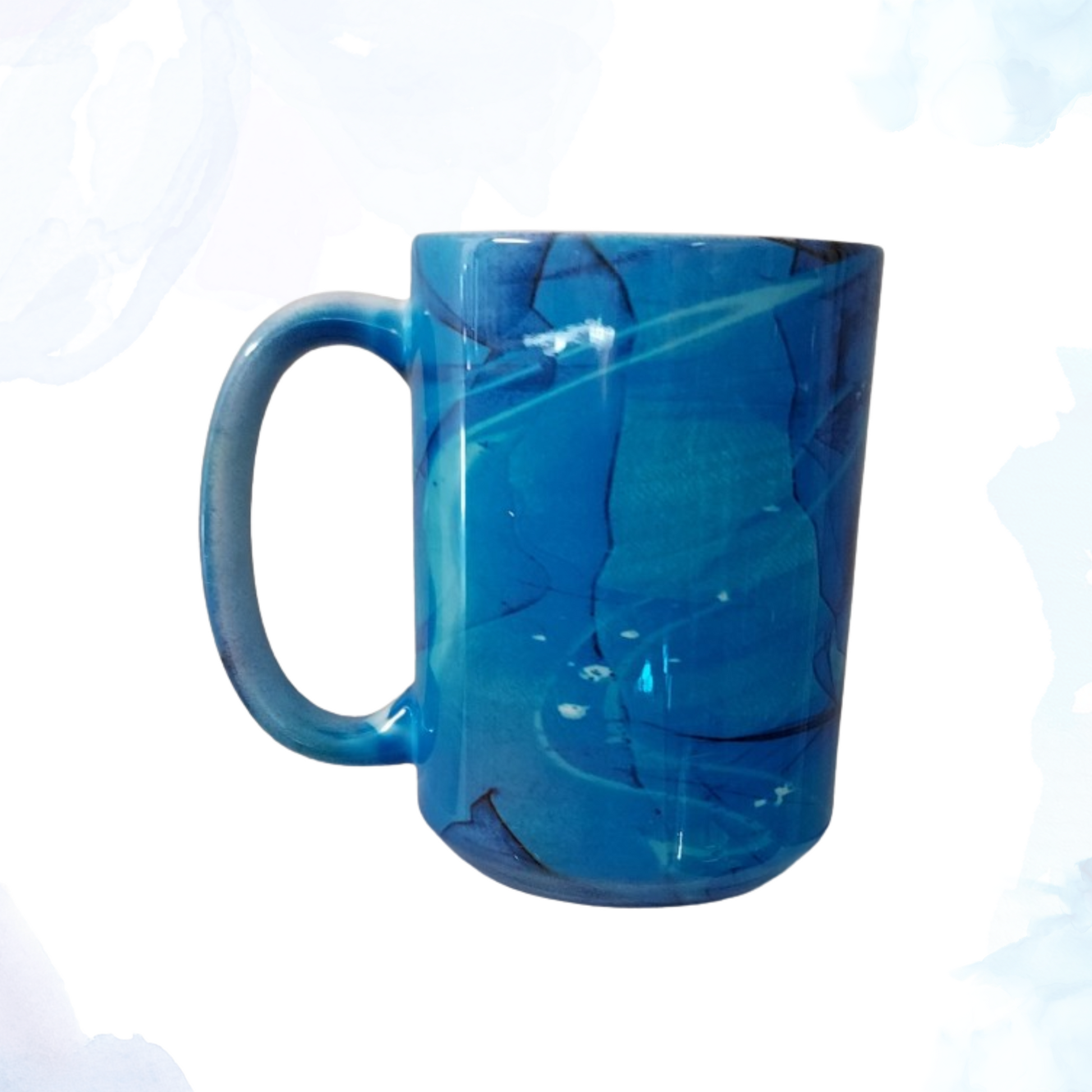 Experience your morning cup of coffee or tea like never before with our 15 oz. Blue Swirl Ceramic Mug!&nbsp;   A perfect blend of functionality and artistry. This generously sized mug is ideal for your favorite hot beverages, from coffee and tea to hot chocolate. Crafted from high-quality ceramic, it features a mesmerizing blue swirl design that adds a touch of elegance to your daily routine. 