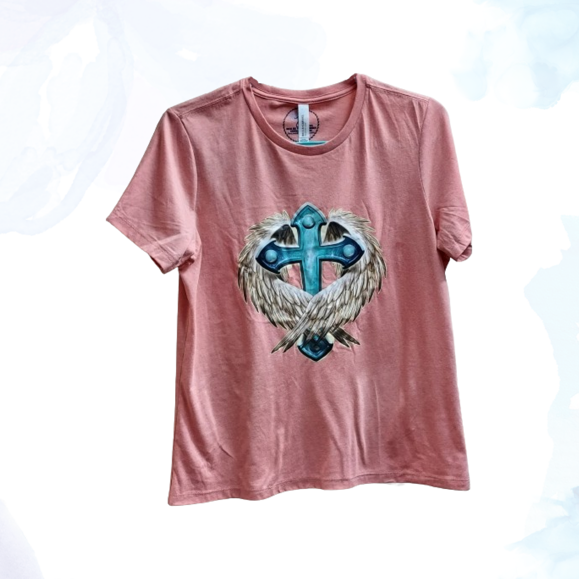 Embrace a blend of faith and freedom with our Cross &amp; Wings Tee, a symbol of spiritual strength and personal expression. This striking t-shirt is designed for those who value both their faith and their individuality, making it a meaningful addition to any wardrobe.