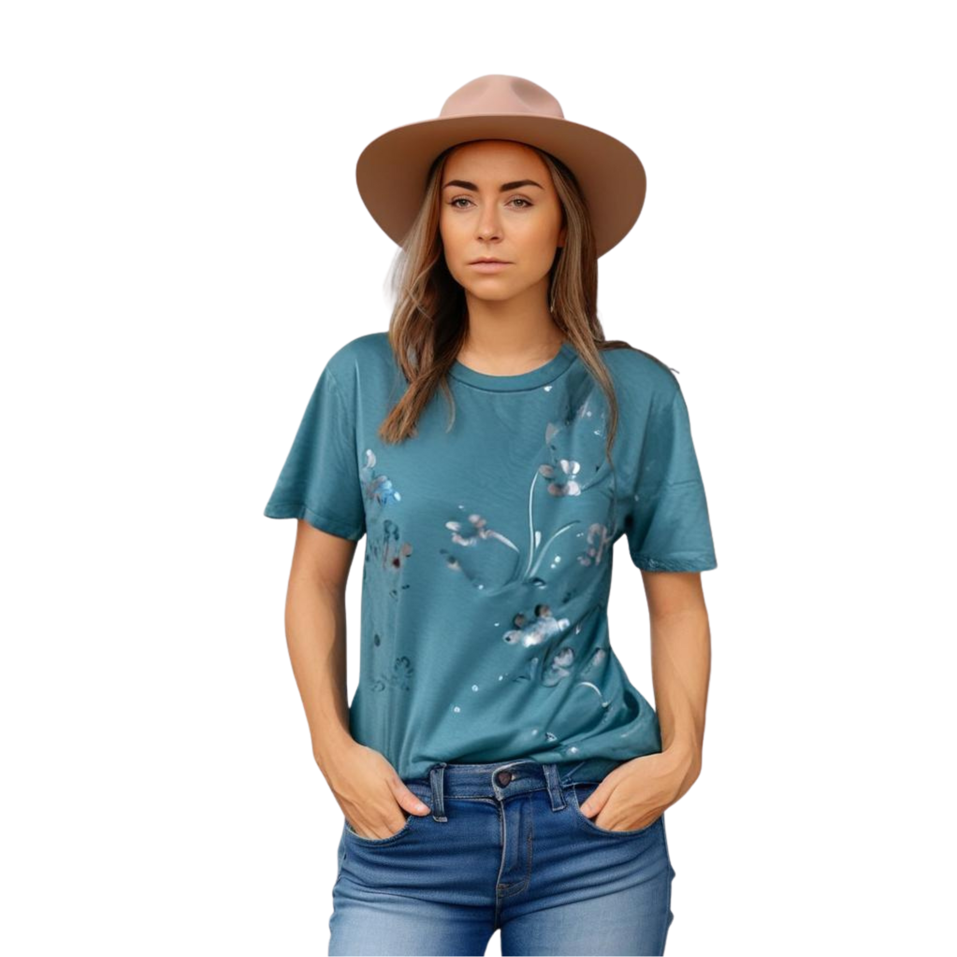 Woman wearing a teal t-shirt with floral designs and a beige hat on a white background